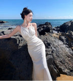 2025 Summer White Hanging Neck Sling Dress Female Vertiny Fishtail High-End Seaside Vacation Super Fairy Long Skirt