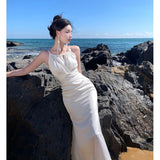 2025 Summer White Hanging Neck Sling Dress Female Vertiny Fishtail High-End Seaside Vacation Super Fairy Long Skirt