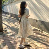 Summer 2026 New Seaside Holiday Temperament Floral Dress Orange Tea Break French Dress Girl Loose