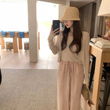 Knitting Season_Soft Sky Silk Sling With Two Sets Of White Knitted Cardigan Outside Sunscreen
